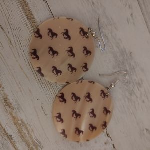 Horse pattern shell earrings.